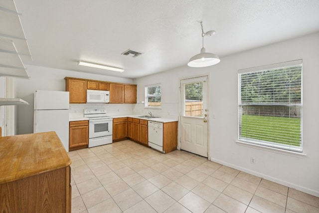 1444 Kenneys Way, Round Rock, TX 78665 - kitchen featuring white appliances, light countertops, pendant lighting, and light tile patterned flooring