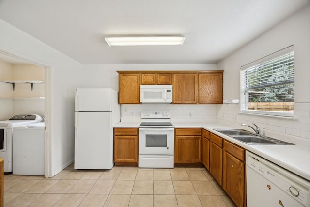 1444 Kenneys Way, Round Rock, TX 78665 - kitchen with white appliances, washing machine and clothes dryer, decorative backsplash, and brown cabinetry