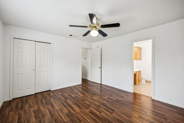 1444 Kenneys Way, Round Rock, TX 78665 - unfurnished bedroom featuring wood finished floors, a closet, a ceiling fan, and ensuite bath