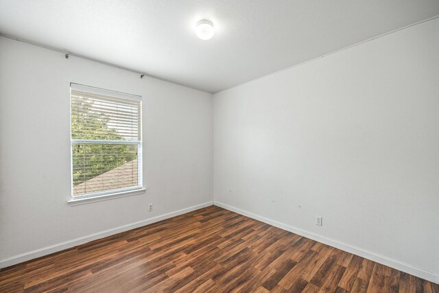 1444 Kenneys Way, Round Rock, TX 78665 - empty room featuring dark wood-type flooring and baseboards