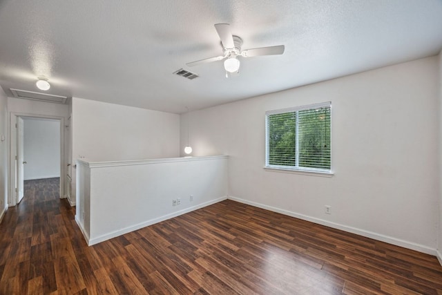 1444 Kenneys Way, Round Rock, TX 78665 - unfurnished room with wood finished floors, ceiling fan, attic access, and a textured ceiling