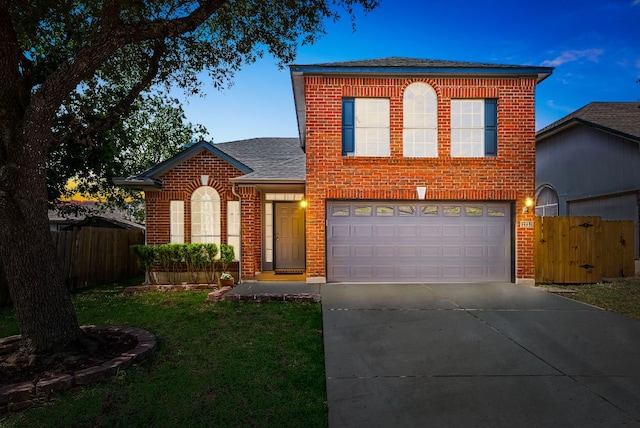 1213 Pathfinder Way, Round Rock, TX 78665 - traditional home with brick siding, roof with shingles, driveway, an attached garage, and a gate