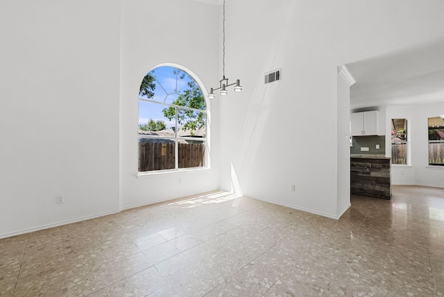 1213 Pathfinder Way, Round Rock, TX 78665 - empty room featuring baseboards and a towering ceiling