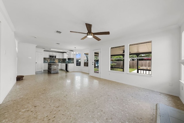 1213 Pathfinder Way, Round Rock, TX 78665 - unfurnished living room featuring a ceiling fan, crown molding, and a chandelier