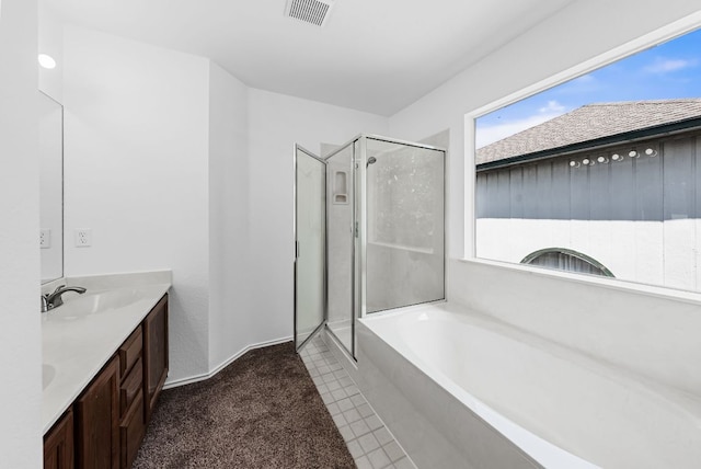 1213 Pathfinder Way, Round Rock, TX 78665 - bathroom featuring a stall shower, a garden tub, double vanity, and tile patterned flooring