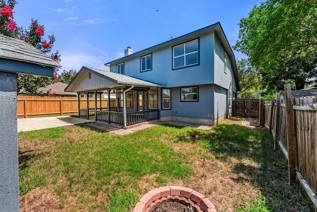1213 Pathfinder Way, Round Rock, TX 78665 - back of house with a patio, a fire pit, a fenced backyard, and a chimney