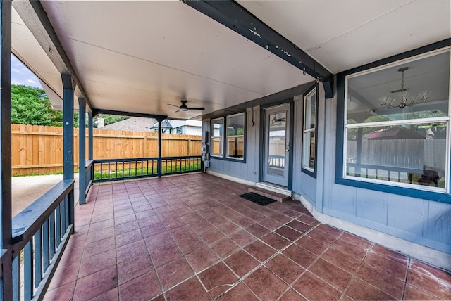 1213 Pathfinder Way, Round Rock, TX 78665 - unfurnished sunroom with ceiling fan and a chandelier