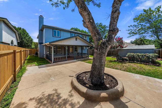 1213 Pathfinder Way, Round Rock, TX 78665 - view of front facade with a porch, a chimney, and a fenced backyard