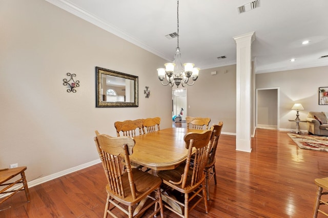 1011 Windmill Rd, Dripping Springs, TX 78620 - dining area featuring ornamental molding, decorative columns, wood finished floors, a chandelier, and recessed lighting