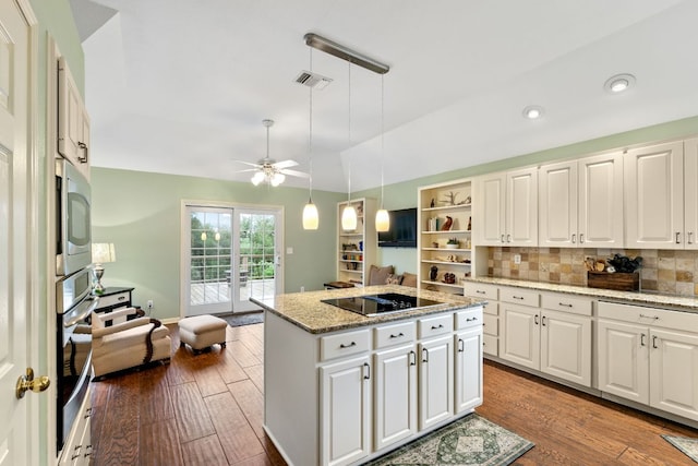 1011 Windmill Rd, Dripping Springs, TX 78620 - kitchen featuring appliances with stainless steel finishes, a kitchen island, wood finished floors, a ceiling fan, and lofted ceiling