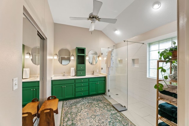 1011 Windmill Rd, Dripping Springs, TX 78620 - bathroom featuring a shower with shower door, double vanity, ceiling fan, vaulted ceiling, and tile patterned flooring