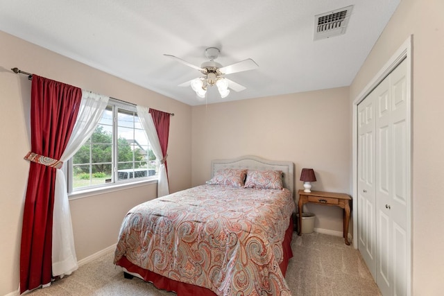 1011 Windmill Rd, Dripping Springs, TX 78620 - bedroom featuring carpet floors, a closet, and a ceiling fan