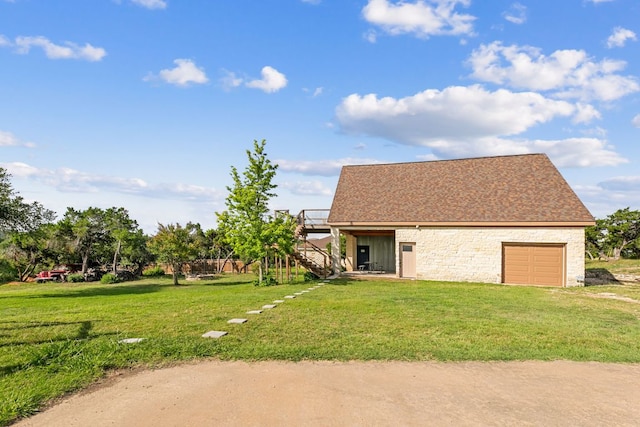 1011 Windmill Rd, Dripping Springs, TX 78620 - view of home's exterior featuring stairway, stone siding, a yard, a wooden deck, and roof with shingles