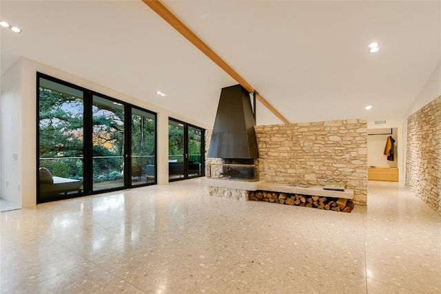 1900 Airole Way, Austin, TX 78704 - unfurnished living room with a towering ceiling, a fireplace, and speckle patterned floor