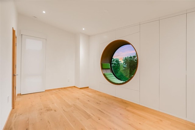 1900 Airole Way, Austin, TX 78704 - empty room with light wood-style flooring and recessed lighting
