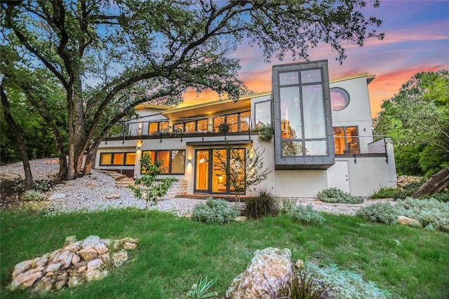 1900 Airole Way, Austin, TX 78704 - back of property featuring a balcony and stucco siding