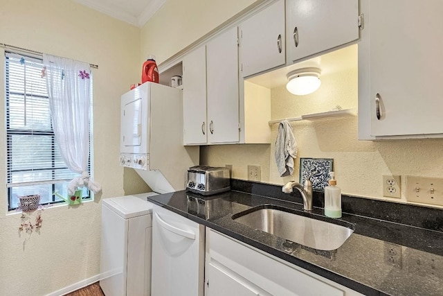 303 W 35th St Unit 202, Austin, TX 78705 - laundry area with healthy amount of natural light, stacked washer and clothes dryer, and ornamental molding