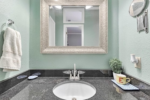 303 W 35th St Unit 202, Austin, TX 78705 - bathroom featuring vanity and a textured wall