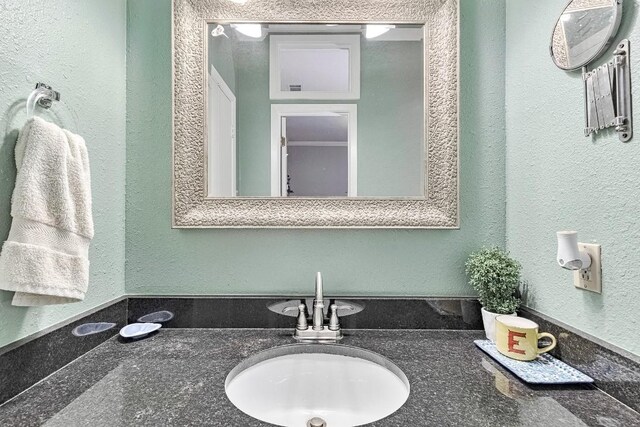 303 W 35th St Unit 202, Austin, TX 78705 - bathroom featuring vanity and a textured wall