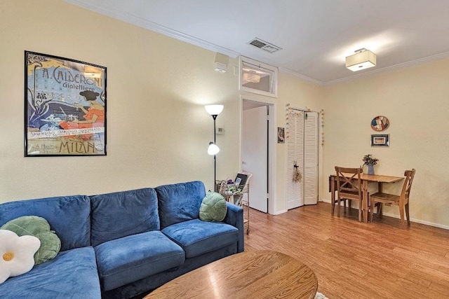 303 W 35th St Unit 202, Austin, TX 78705 - living area featuring wood finished floors and ornamental molding