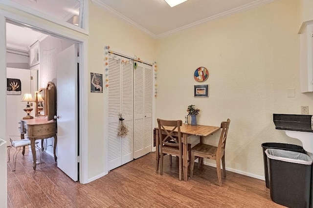 303 W 35th St Unit 202, Austin, TX 78705 - dining room with ornamental molding and wood finished floors