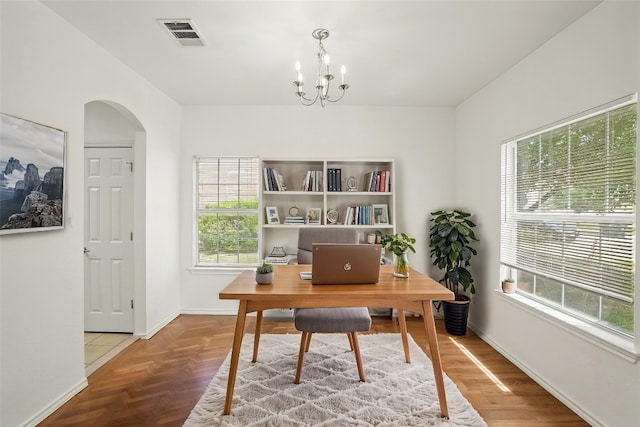 141 Ashwood N, Kyle, TX 78640 - office area with arched walkways and a chandelier