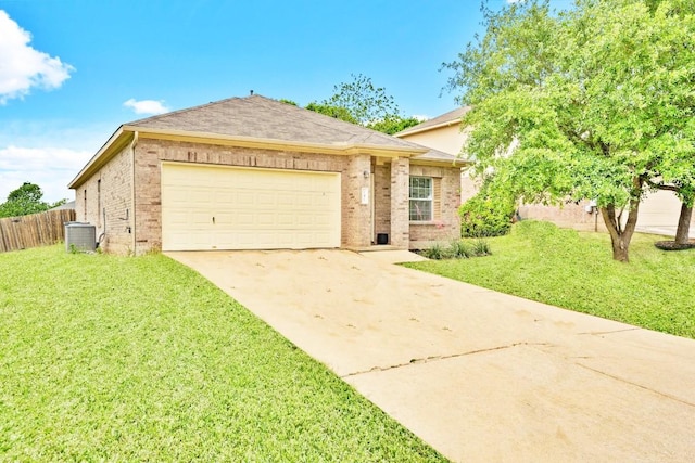 141 Ashwood N, Kyle, TX 78640 - view of front of home with brick siding, concrete driveway, and an attached garage
