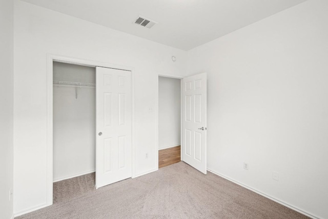 141 Ashwood N, Kyle, TX 78640 - unfurnished bedroom featuring carpet floors and a closet