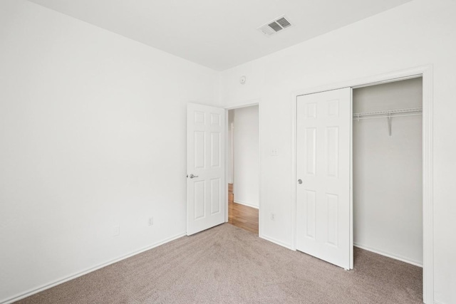 141 Ashwood N, Kyle, TX 78640 - unfurnished bedroom with carpet floors and a closet