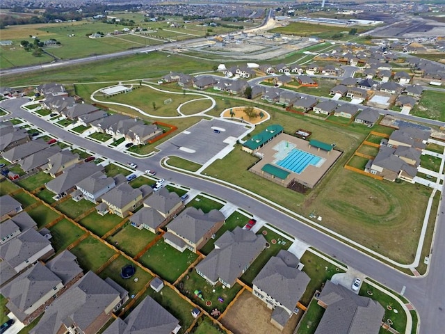 6007 Agostino Cv, Round Rock, TX 78665 - aerial overview of property's location with a pool area and nearby suburban area