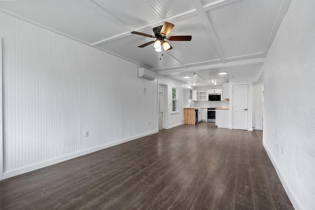 1216 Jones St, Taylor, TX 76574 - unfurnished living room featuring an AC wall unit, ceiling fan, and dark wood-type flooring