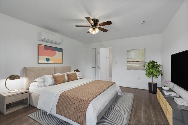 1216 Jones St, Taylor, TX 76574 - bedroom with a wall mounted AC, wood finished floors, and ceiling fan