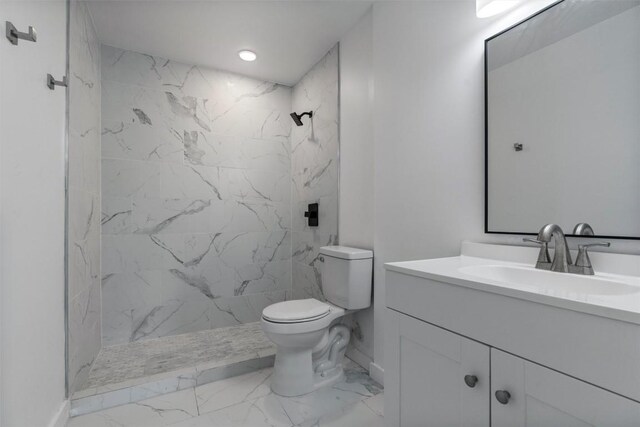 1216 Jones St, Taylor, TX 76574 - bathroom with marble look tiles, vanity, a marble finish shower, and recessed lighting