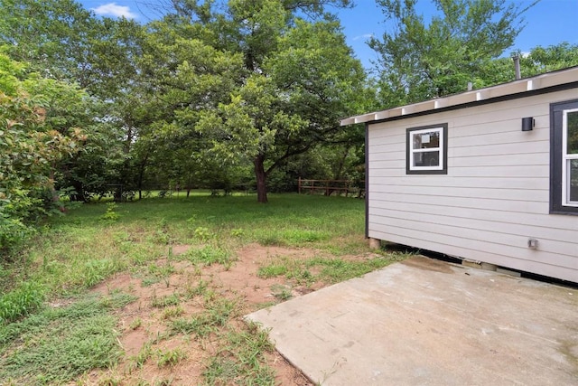 1216 Jones St, Taylor, TX 76574 - view of green lawn featuring a patio area