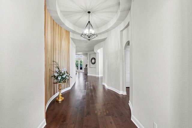 1720 Boscello Ct, Leander, TX 78641 - hall featuring a chandelier, wood-type flooring, and arched walkways