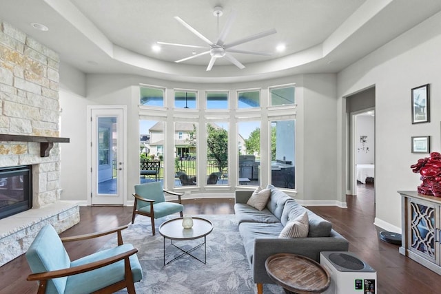 1720 Boscello Ct, Leander, TX 78641 - living area featuring a ceiling fan, wood finished floors, a stone fireplace, and recessed lighting