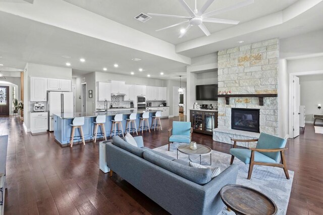 1720 Boscello Ct, Leander, TX 78641 - living area with a ceiling fan, dark wood-style flooring, recessed lighting, and a fireplace