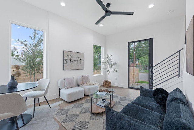 54 Robert T Martinez Jr St, Austin, TX 78702 - living room featuring recessed lighting, a ceiling fan, light wood-style floors, and stairs