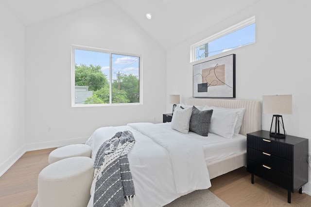 54 Robert T Martinez Jr St, Austin, TX 78702 - bedroom featuring wood finished floors, high vaulted ceiling, and recessed lighting