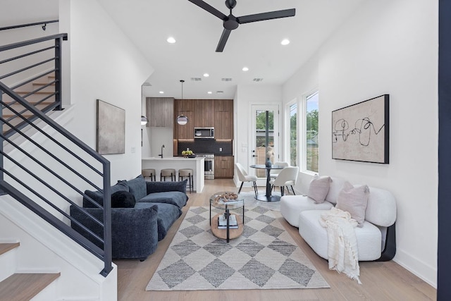 54 Robert T Martinez Jr St, Austin, TX 78702 - living area featuring a ceiling fan, light wood-type flooring, recessed lighting, and stairway