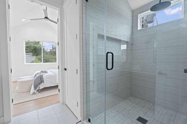 54 Robert T Martinez Jr St, Austin, TX 78702 - ensuite bathroom featuring tile patterned flooring, a stall shower, lofted ceiling, and ceiling fan
