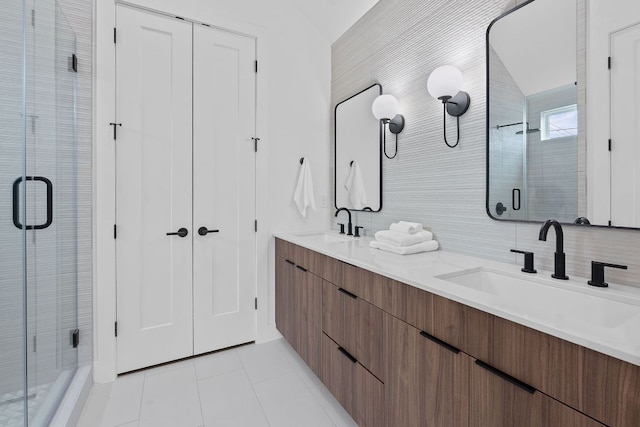 54 Robert T Martinez Jr St, Austin, TX 78702 - bathroom with a shower stall, tile patterned floors, and double vanity