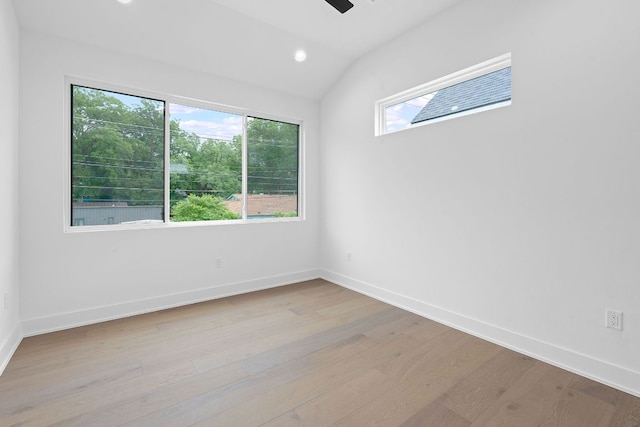 54 Robert T Martinez Jr St, Austin, TX 78702 - spare room featuring plenty of natural light, light wood-style flooring, vaulted ceiling, recessed lighting, and a ceiling fan