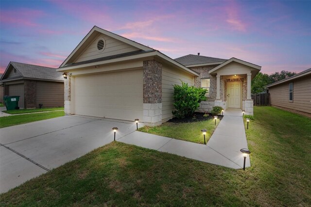 3402 Tilmon Ln, Austin, TX 78725 - single story home featuring an attached garage, a front lawn, brick siding, and driveway