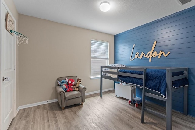 3402 Tilmon Ln, Austin, TX 78725 - bedroom with wood finished floors and baseboards