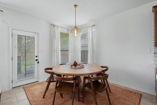 4201 Veiled Falls Dr, Pflugerville, TX 78660 - dining space featuring plenty of natural light and light tile patterned floors