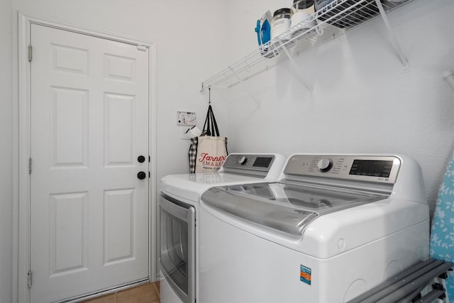 4201 Veiled Falls Dr, Pflugerville, TX 78660 - washroom featuring washer and clothes dryer and light tile patterned floors