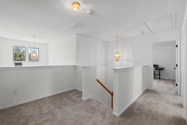 4201 Veiled Falls Dr, Pflugerville, TX 78660 - hallway with attic access, an upstairs landing, and carpet