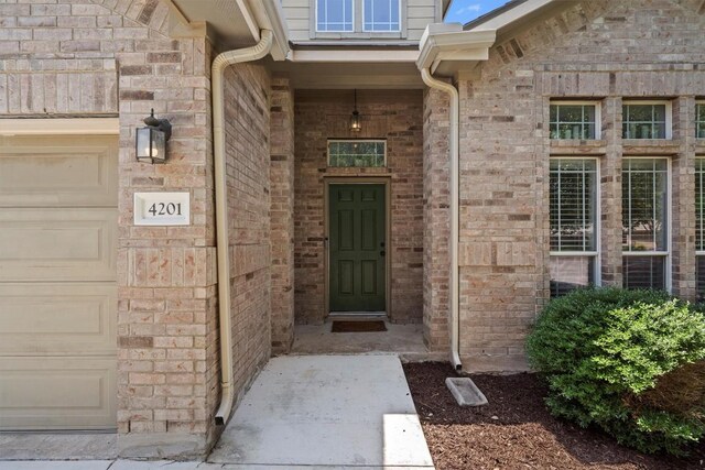 4201 Veiled Falls Dr, Pflugerville, TX 78660 - entrance to property with brick siding and an attached garage