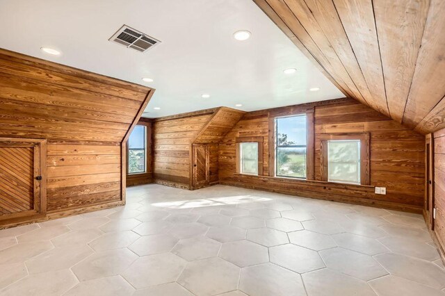 3701 Fm 972, Georgetown, TX 78626 - additional living space featuring wooden walls, vaulted ceiling, and recessed lighting